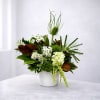 A unique verdant green and white arrangement with interesting textures.
