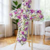 This stunning cross arrangement features a beautiful mix of  purple lisianthus