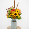 Mixed fall flowers in a milk jug.  Perfect for the fall.