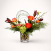 Winter Citrus is a bright, modern floral arrangement designed to bring warmth