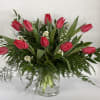This elegant arrangement is made of tulips, accented with white asters, and