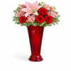A romantic mix of pink lilies, red roses, and sweet seasonal blooms