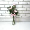 3 beautiful carnations arranged in a bud vase. A classic look for