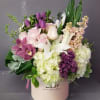 Beautiful round box flower arrangement for the perfect Mother's Day gift.