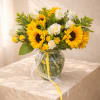 A radiant arrangement of vibrant sunflowers and classic white roses accented with