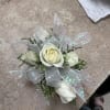 Beautiful white sweet heart roses with delicate greenery, white filler and white