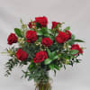 Select this vase arrangement of one dozen medium stem red roses, with