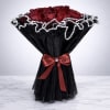 A bold and luxurious bouquet of premium red roses wrapped in elegant