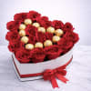 A luxurious heart-shaped box filled with premium red roses and decadent Ferrero