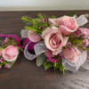 Sweet light pink roses with pink wax flowers and a bit of