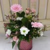 Wow her with this mixed arrangement in a decorative vase.