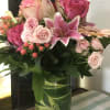 This collection of pinks includes stargazer lillies, pink spray roses, esperance roses