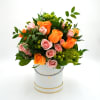 Includes Orange roses, pink spray roses, hypericum green, and mini hydrangeas green

Box
