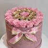 This grand hatbox features preserved blush pink roses encircling a radiant cluster