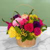 This arrangement has roses, daisies, lisianthus, spray roses, gerbera daisies, and other