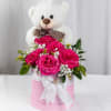A charming blend of vibrant pink roses, baby&rsquo;s breath, and lush greenery
