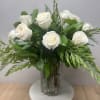 A classic rose arrangement with modern styled greens.
Pictures is standard size 1