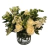 A low and luscious bouquet of premium white flowers &amp; foliage.