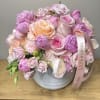 20 luxury pink peonies surrounded by roses and seasonal flowers in a