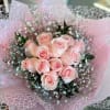 A timeless bouquet of velvety blush roses, wrapped delicately with airy baby&rsquo;s