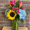 This beautiful arrangement is designed in a glass vase and filled with