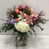 Stock, lilies, hydrangeas, roses, spray roses, filler and assorted greenery arranged in