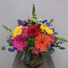 Bright mixture of gerber daisies and other flowers such as roses and