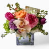 Soft pink roses meet graceful orchids in this elegant bouquet, handcrafted with