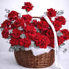 Basket of red roses with a white ribbon