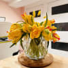 Beautiful yellow parrot tulips spectacularly overflowing in an abundant, luxe arrangement. Note: