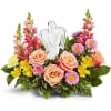 Radiating peace and comfort, Teleflora's Angel's Embrace Bouquet surrounds a sparkling crystal