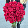 Make a bold statement with the red rose arrangement, beautifully wrapped in