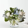 A soft blend of whites and blues flowers  that creates a