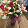 6 RED ROSES  with 3 LILIE STEMS   NOTE: (lilies
