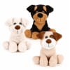 Three plush dog toys in white, black, and tan sit on a white background.