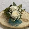 Two roses wrist corsage with baby's breath, green and a bow. Bow