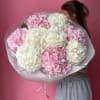 A lush mono-bouquet of white and pink hydrangeas &mdash; a graceful blend
