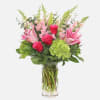 Hot pink roses, green hydrangeas, pink lily, pink stock, salal tips, and