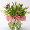 Combination of assorted Tulips with pink hydrangeas in a bubble vase.
Premium: 30
