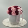 Mix of pink and red preserved red roses in a white ceramic