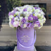 Beautiful arrangement of fresh flowers in our signature lavender velvet box 