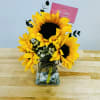 A beautiful and  cozy little jar with these 3 beautiful sunflowers