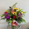 A bright and cheerful mix of snapdragons, sunflowers, stock, alstroemeria and carnations!
