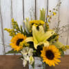 Bright yellow arrangement with sunflowers lilies, accent, yellow fillers designed in a
