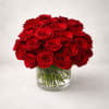 A striking arrangement of thirty-six premium red roses, expertly designed in a
