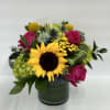 Sunflower and pink rose arrangement in a green vase
