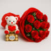 A beautifully wrapped dozen red roses paired with a box of chocolates