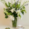 Beauty begins within the heart. Pure white roses, fragrant lilies, white hydrangeas