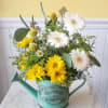 Pour on the spring charm with this sunny yellow and white bouquet