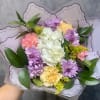 A soft and elegant mix of lavender mums, creamy hydrangea, buttery yellow